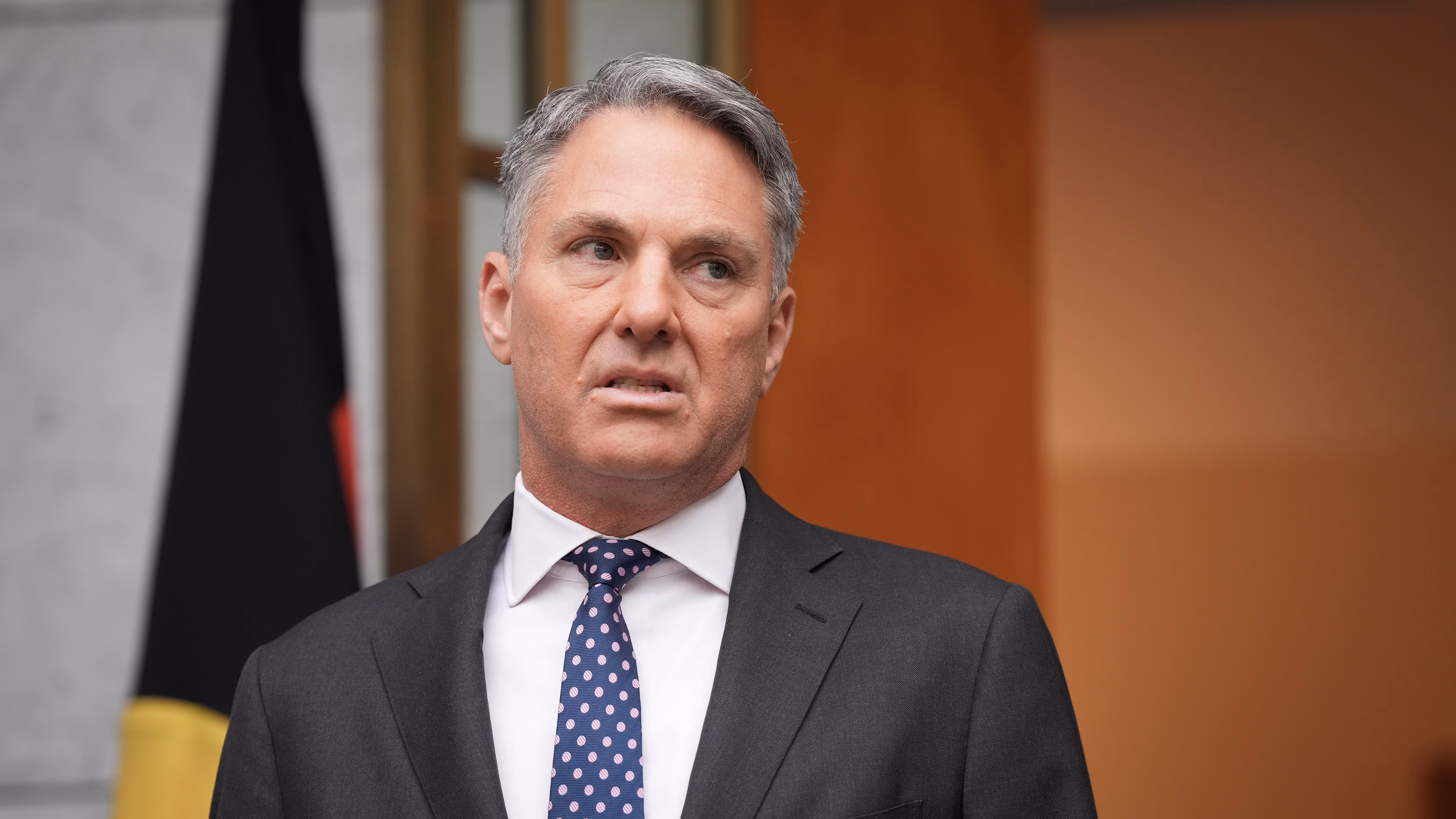 Close up of Richard Marles wearing a suit and tie. 